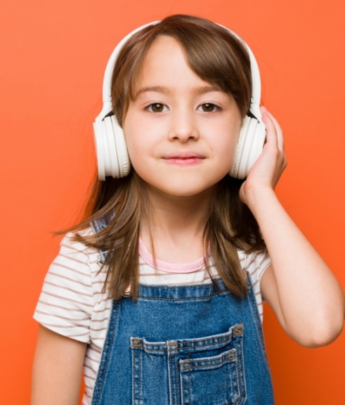 Young girl wearing headphones