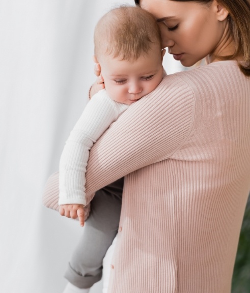 Mother holding her toddler