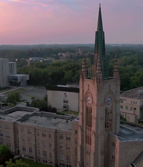 Aerial view of a clock tower on a university campus